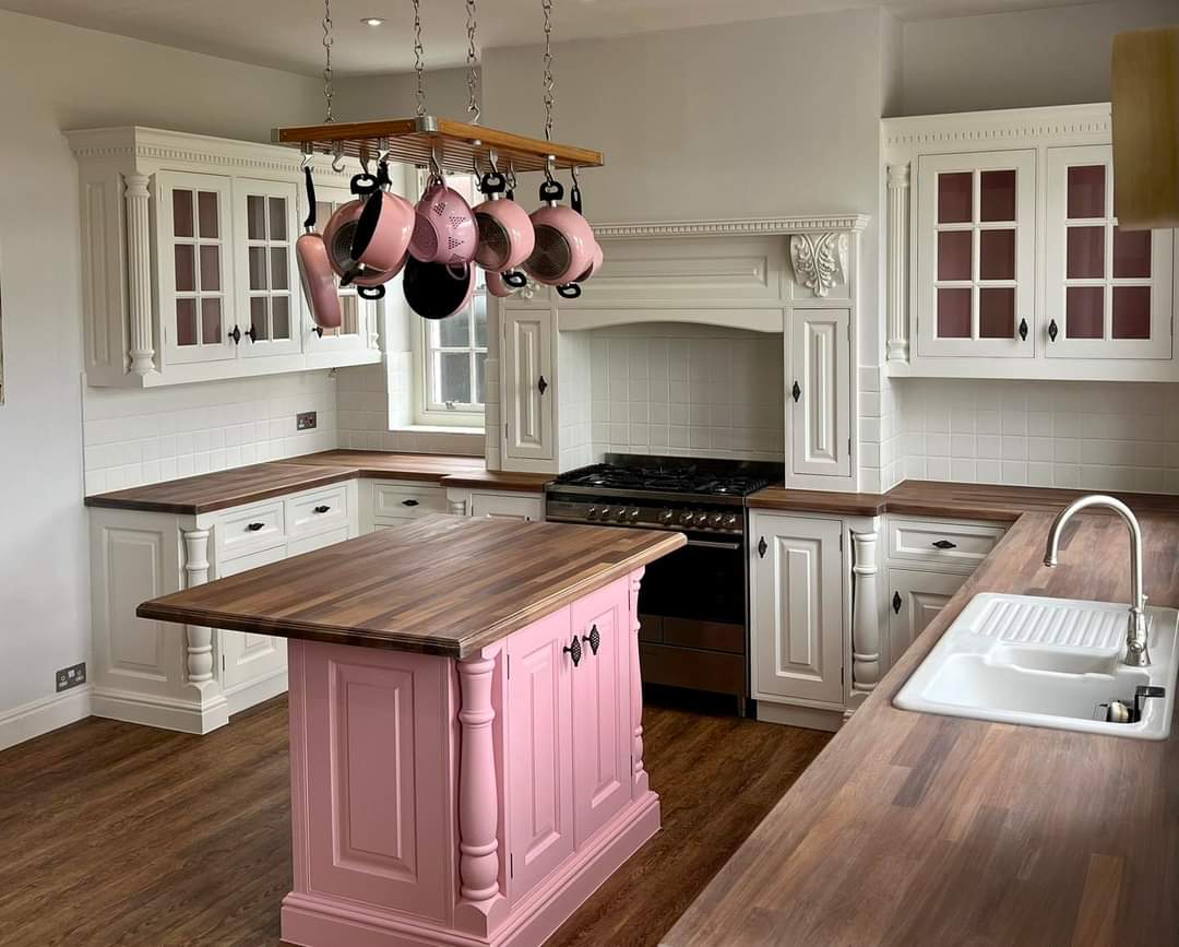 Hand-painted kitchen cabinets finished with a traditional painted look suited to classic homes