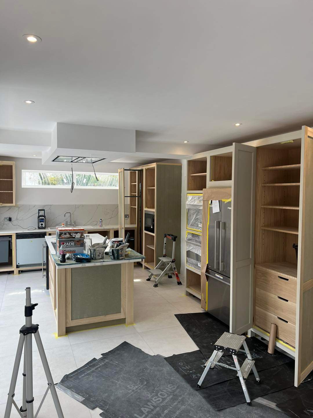 New bespoke kitchen installation before specialist hand painting
