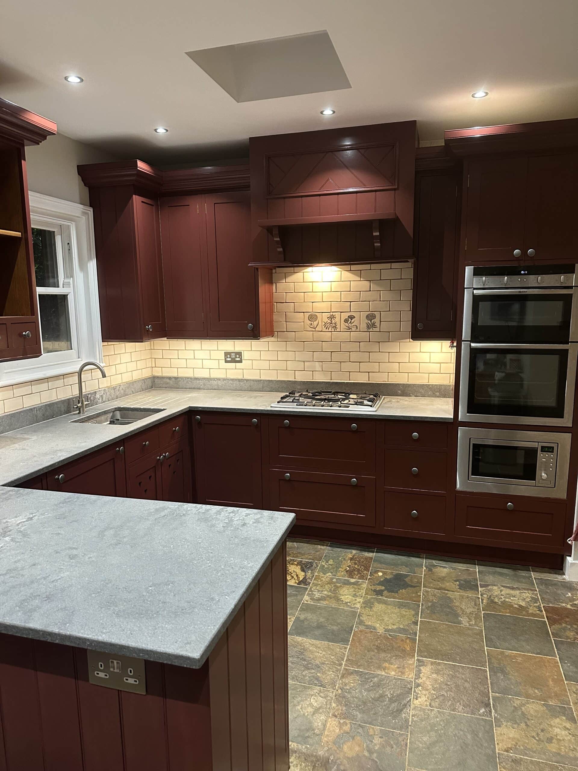 Reclaimed pine kitchen transformed with a rich red hand painted finish in Shenley Hertfordshire